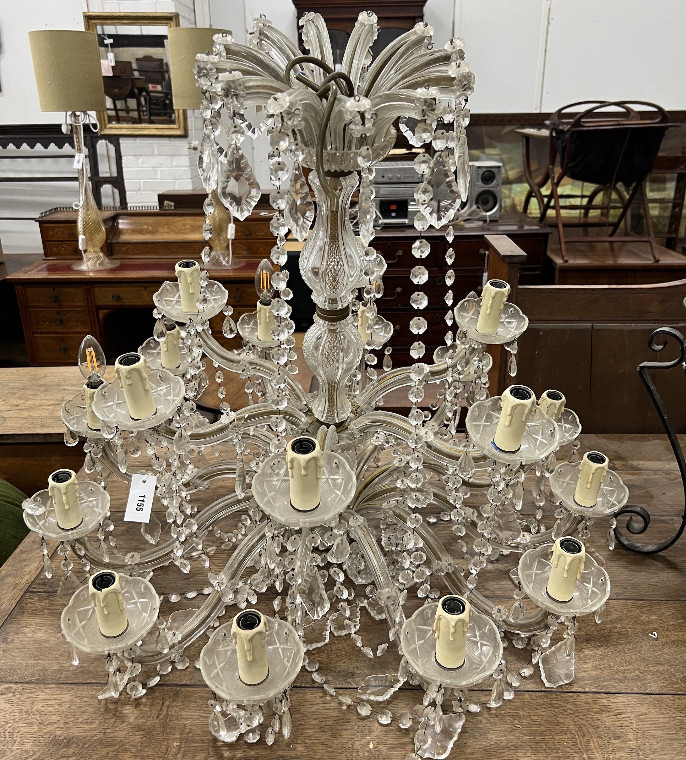 A moulded glass eighteen branch chandelier, hung circular and pear shaped faceted drops, height 56cm